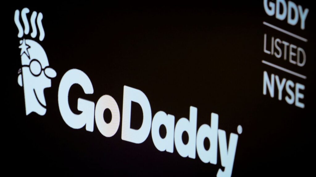 The company logo and ticker for GoDaddy Inc. is displayed on a screen on the floor of the New York Stock Exchange (NYSE) in New York, U.S., March 4, 2019. (Reuters/Brendan McDermid)