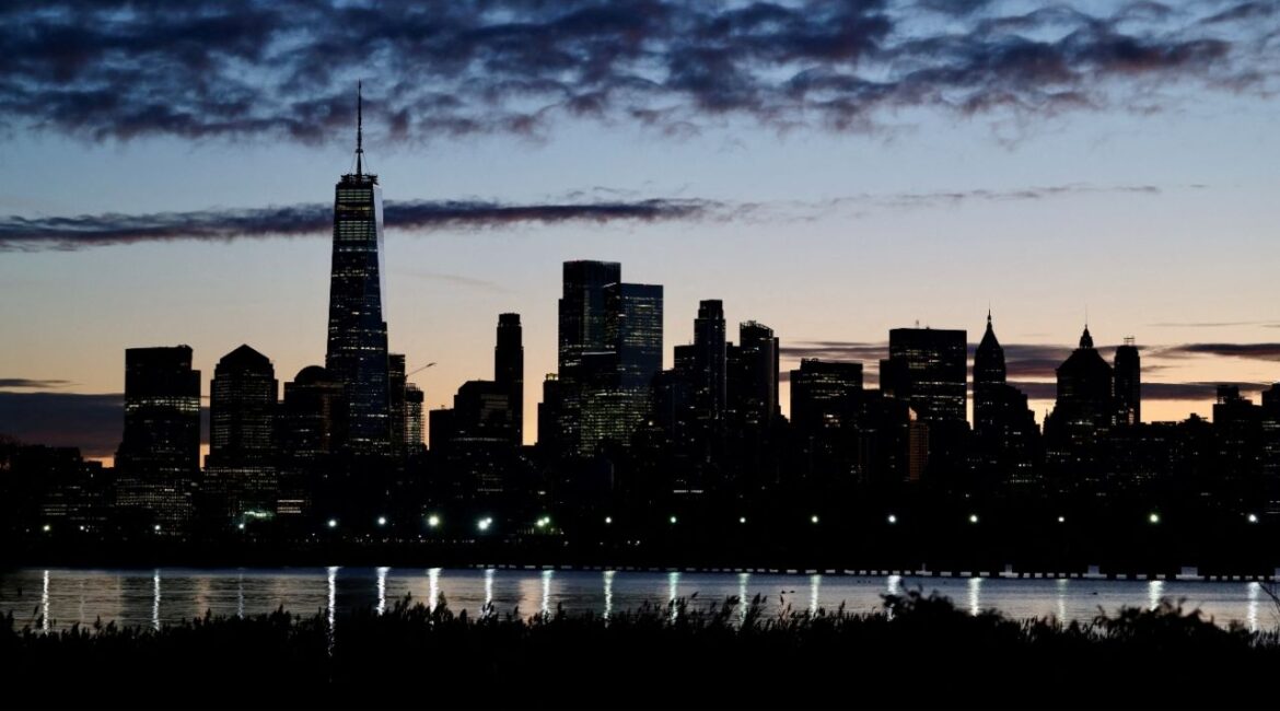The skyline of Lower Manhattan is seen at dawn from across the Hudson River in New York City, U.S., October 18, 2025.(Reuters/Kevin Coombs)