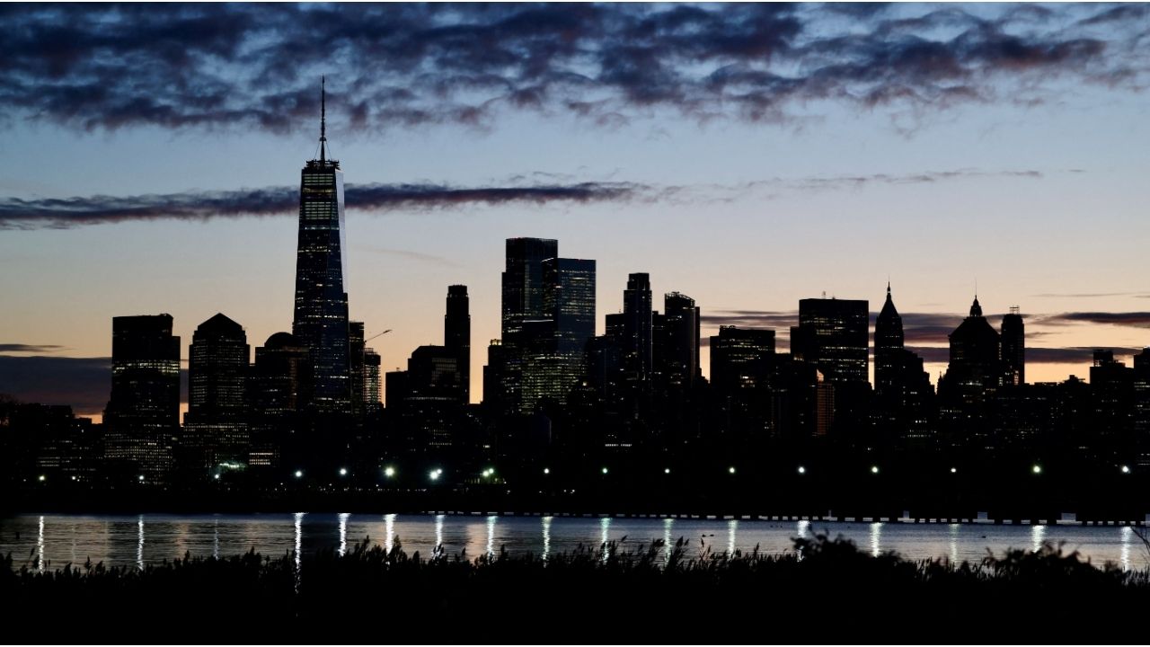 The skyline of Lower Manhattan is seen at dawn from across the Hudson River in New York City, U.S., October 18, 2025.(Reuters/Kevin Coombs)