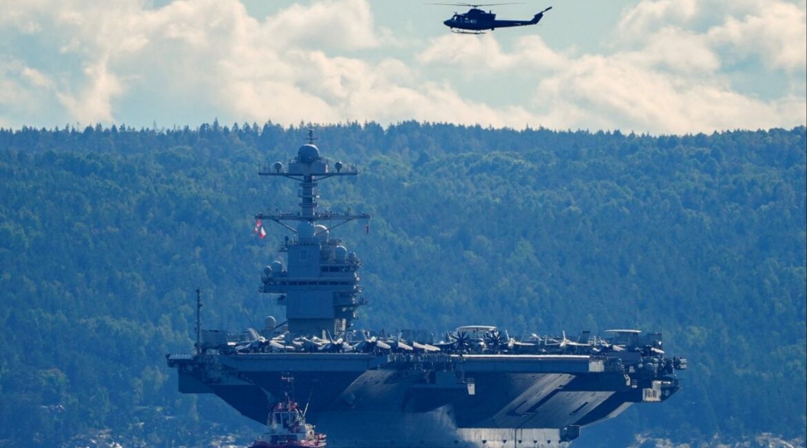 The world's largest warship, U.S. aircraft carrier USS Gerald R. Ford, on its way out of the Oslofjord at Nesodden and Bygdoy, Norway, September 17, 2025. (NTB/Lise Aserud via Reuters)