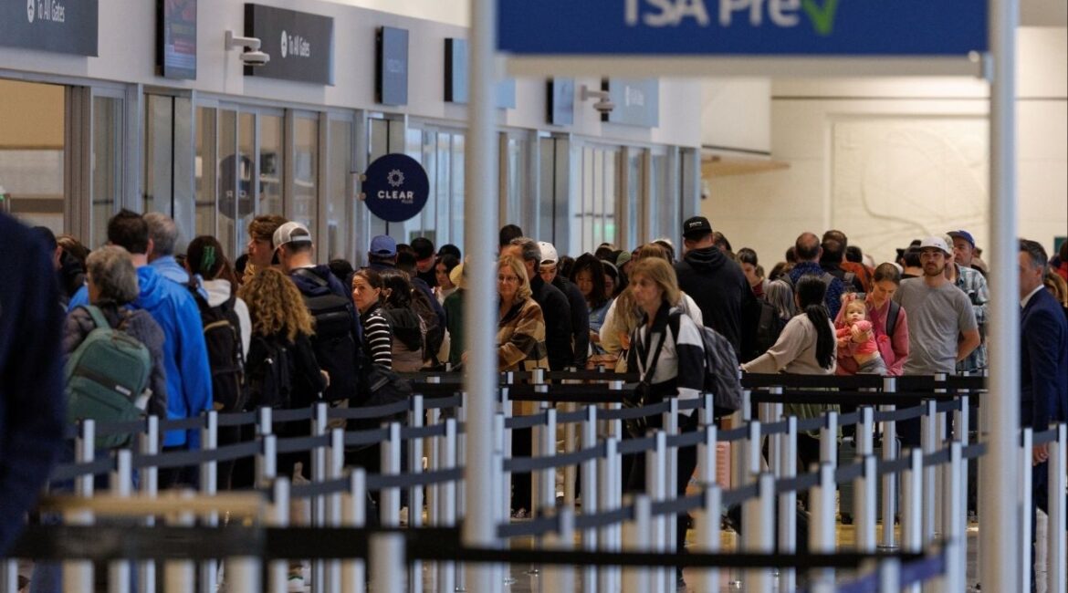 Travelers wait to clear security at San Diego International Airport after U.S. Department of Transportation, due to the ongoing government shutdown, imposed a 10% cutback on flight capacity at selected airports that include the country's busiest one-runway airport in San Diego, California, U.S., November 7, 2025. (Reuters/Mike Blake)
