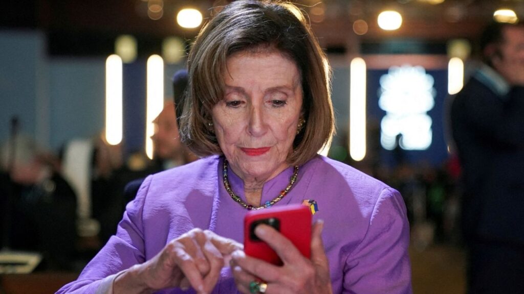 U.S. House Speaker Nancy Pelosi looks at her phone, as she attends the COP27 climate summit, in Sharm el-Sheikh, Egypt, November 11, 2022. (Reuters File)
