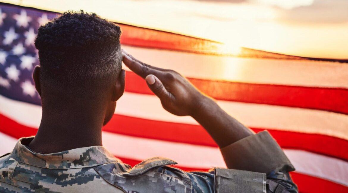 Image of a soldier saluting the American flag in honor of veterans day