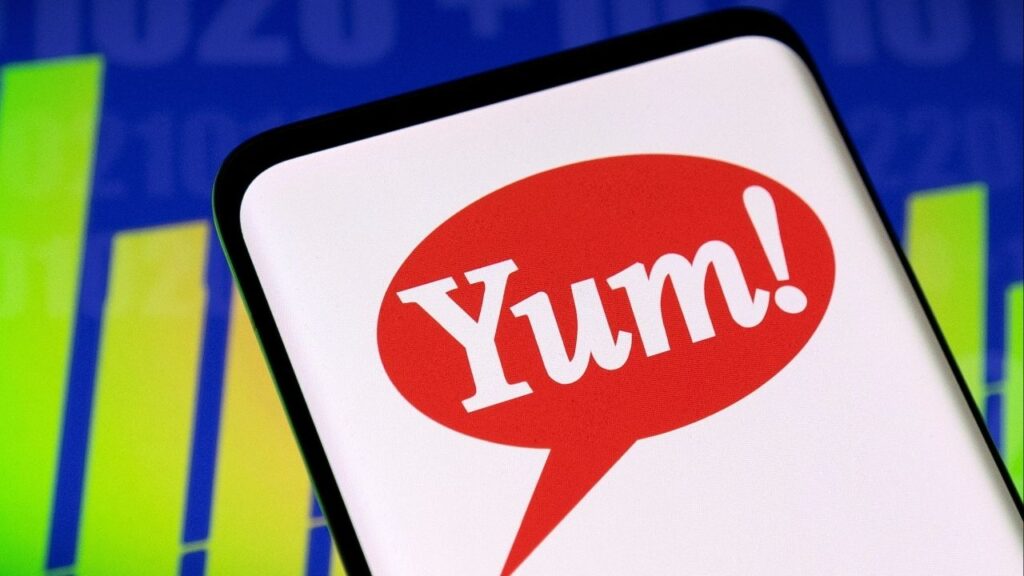 Yum Brands logo and stock graph are seen displayed in this illustration taken, May 3, 2022. (Reuters/Dado Ruvic/Illustration)