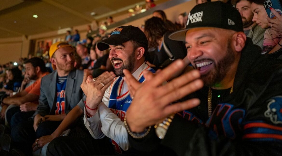 Zohran Mamdani, the Democratic nominee for New York City Mayor, center, attends a New York Knicks basketball game with Joel Armogasto Martinez, also known as The Kid Metro, in New York, on Sunday, Nov. 2, 2025. Mamdani’s low-key appearance at Madison Square Garden underscored the accessibility and relatability he has tried to convey as a candidate. (Jonah Markowitz/The New York Times)