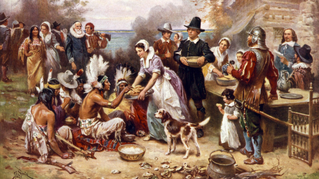 Painted representation of the first Thanksgiving with Pilgrims and Native Americans
