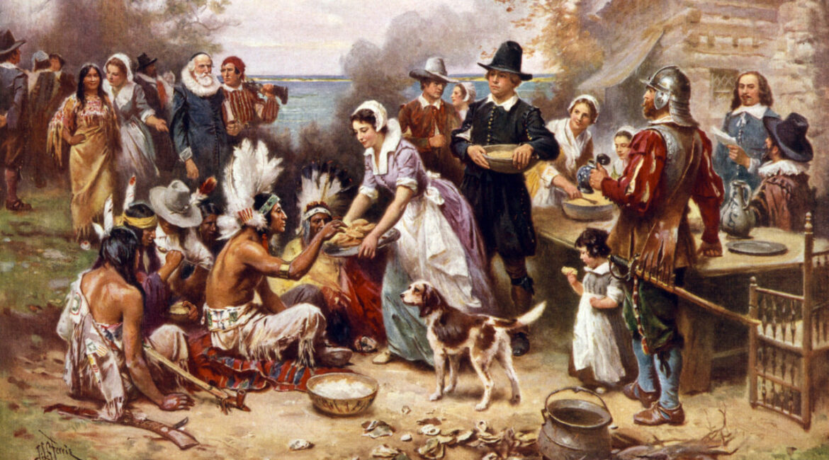 Painted representation of the first Thanksgiving with Pilgrims and Native Americans