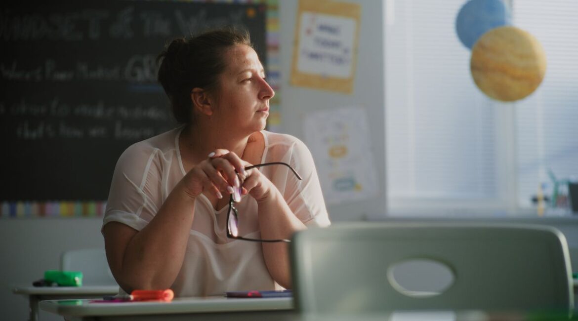 Image of a tired female teacher under stress