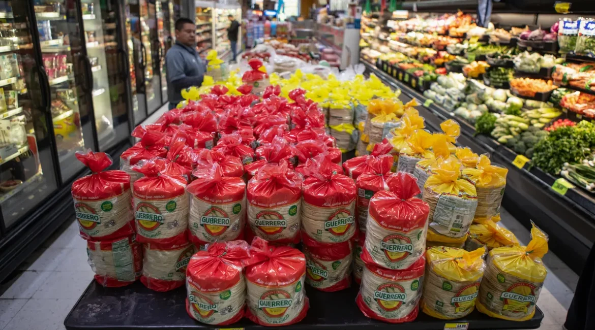 Image of stacks of tortillas on a table in the aisle of a supermarkets