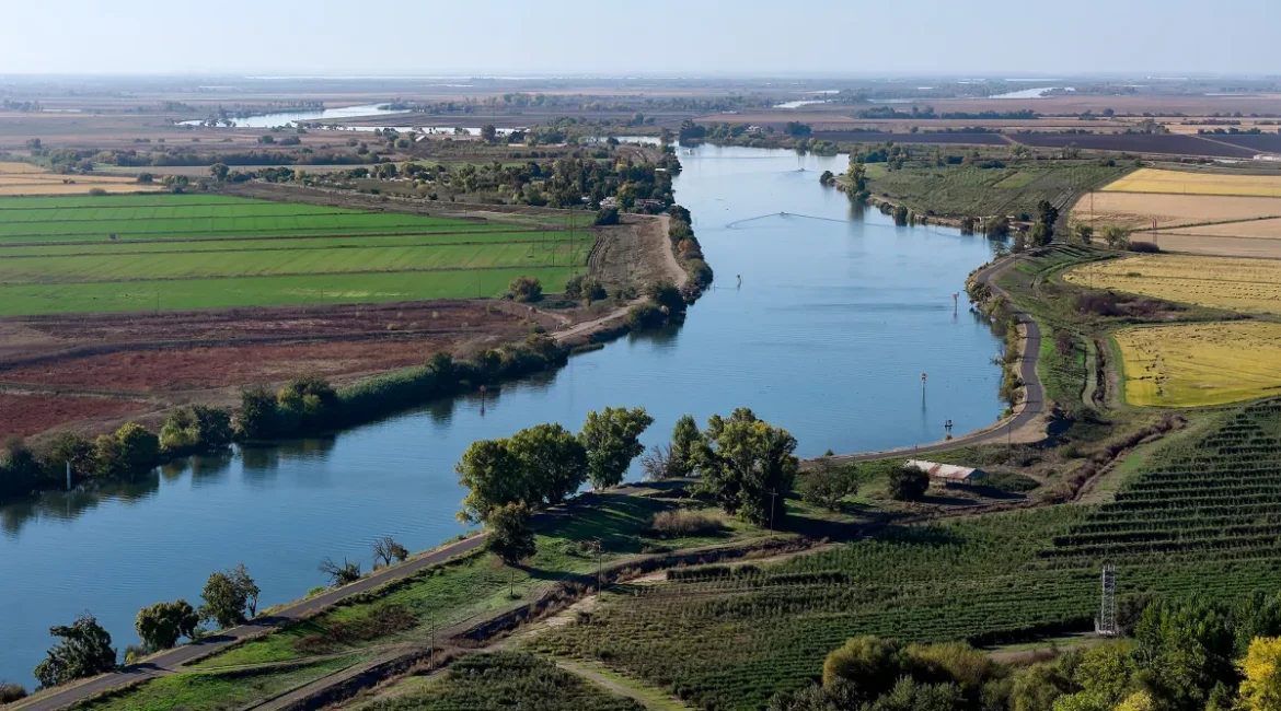 Aerial view of the San Joaquin River flowing through farm fields near Stockton, California