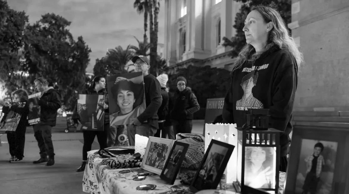 Black and white image of attendees at a vigil for people killed by drunk drivers