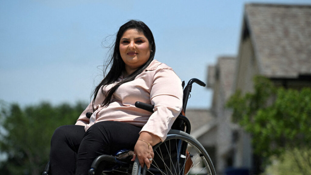 Image of Trump voter Loretta Torres sitting in a wheel chair