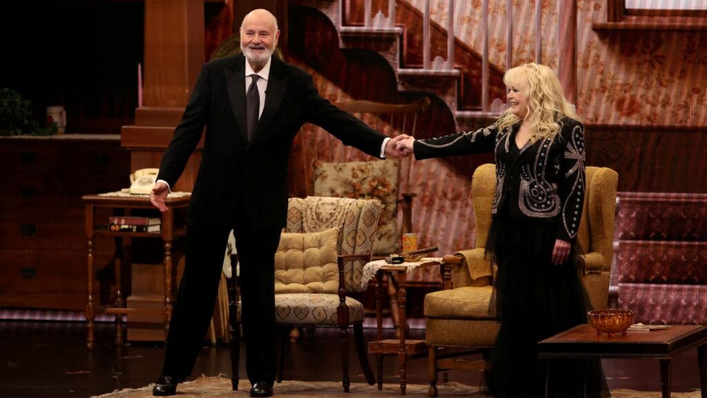 Image of Rob Reiner and Sally Struthers recreating their roles in "All in the Family" in 2024.