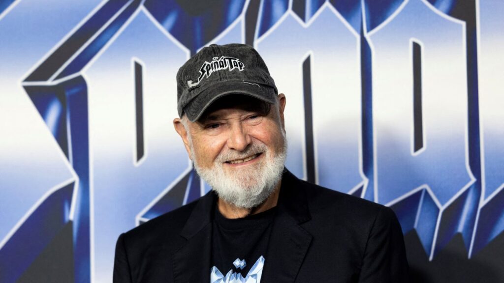 Image of Rob Reiner, who is wearing a dark sport jacket and a baseball cap