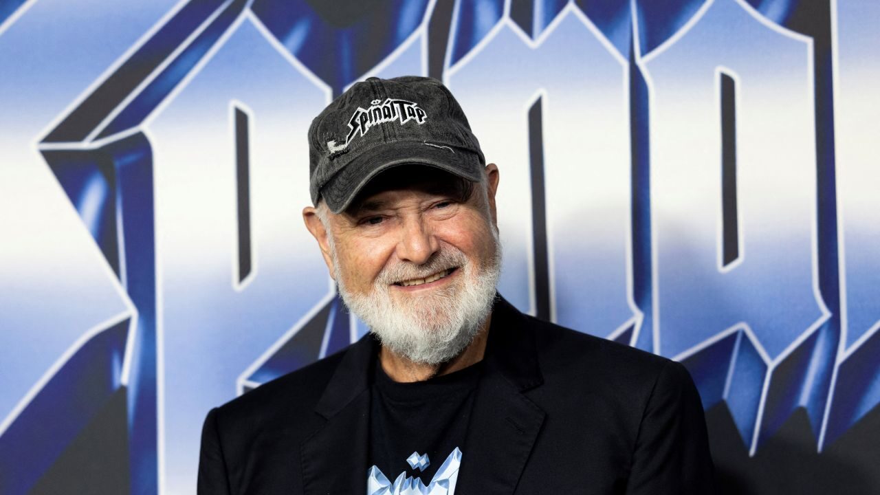 Image of Rob Reiner, who is wearing a dark sport jacket and a baseball cap