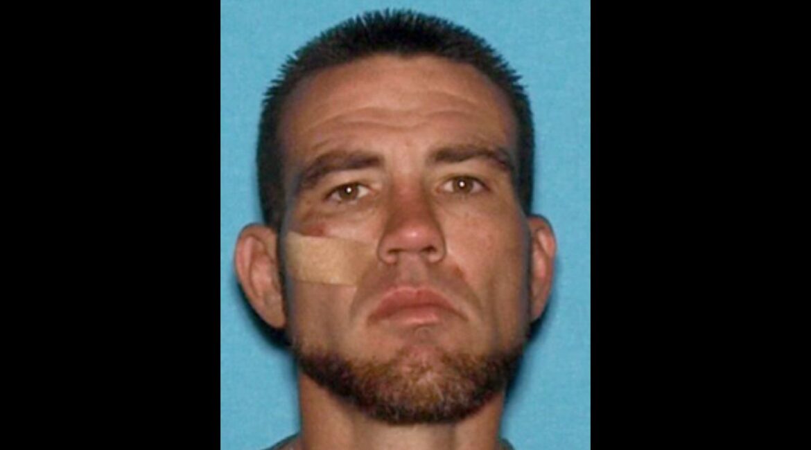 A Fresno police officer was shot at during a struggle with a wanted felon, identified as Bradley Nicolson (pictured), Sunday evening, prompting officers to return fire and critically injure the suspect, authorities said. (Fresno PD)