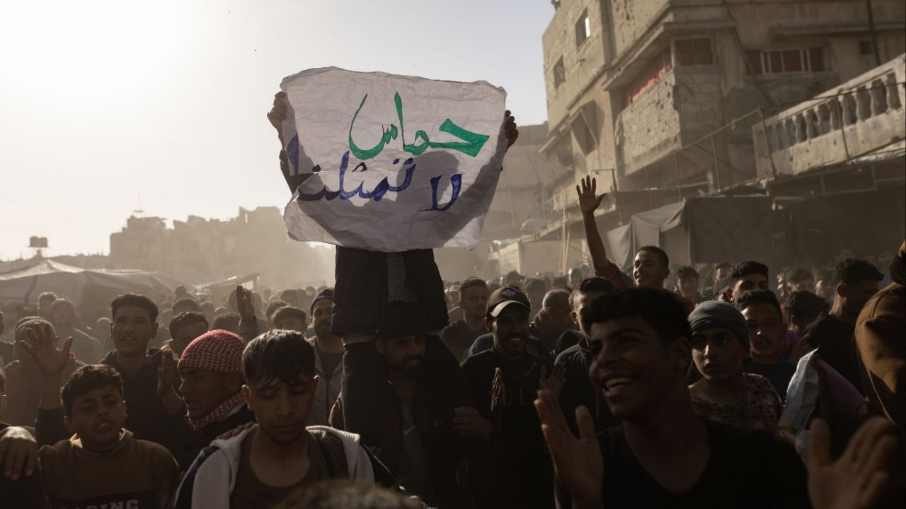A Palestinian protestor holds up a sign reading "Hamas does not represent us," during a demonstration against the group in Beit Lahiya, Gaza Strip, March 26, 2025. A cease-fire after two years of war with Israel has allowed Hamas to tighten its grip on power again. “It’s still standing,” one Israeli official said. (Saher Alghorra/The New York Times)..