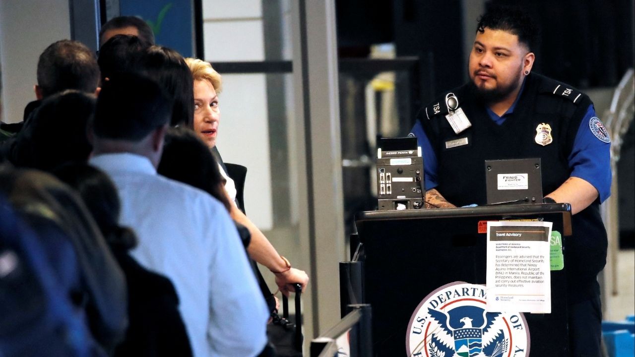 A Transportation Security Administration (TSA) officer checks passengers into security at LaGuardia Airport in New York January 25, 2019. (Reuters File)