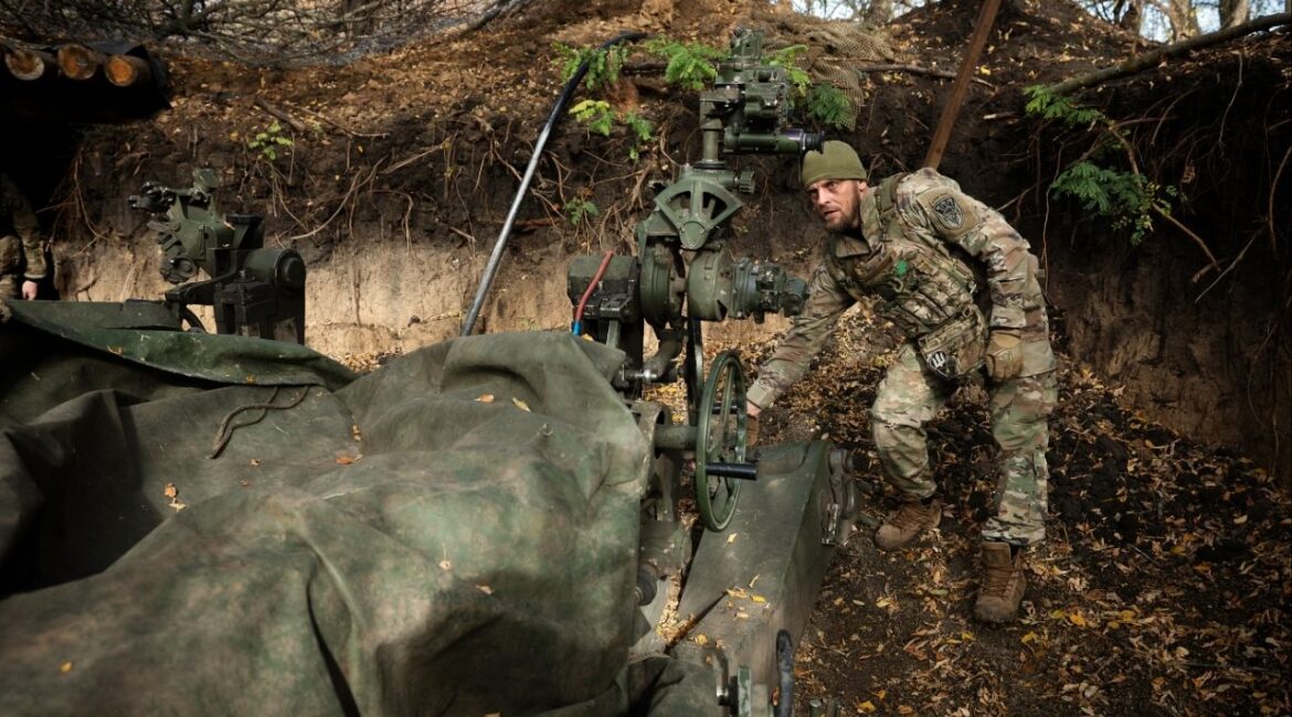 A member of Ukraine’s 148th Artillery Brigade prepares to fire on a Russian target in the Zaporizhzhia region of eastern Ukraine on Oct. 14, 2025. A Ukrainian proposal includes a provision that would compel the United States and European countries to help if the country were attacked again. (Tyler Hicks/The New York Times)