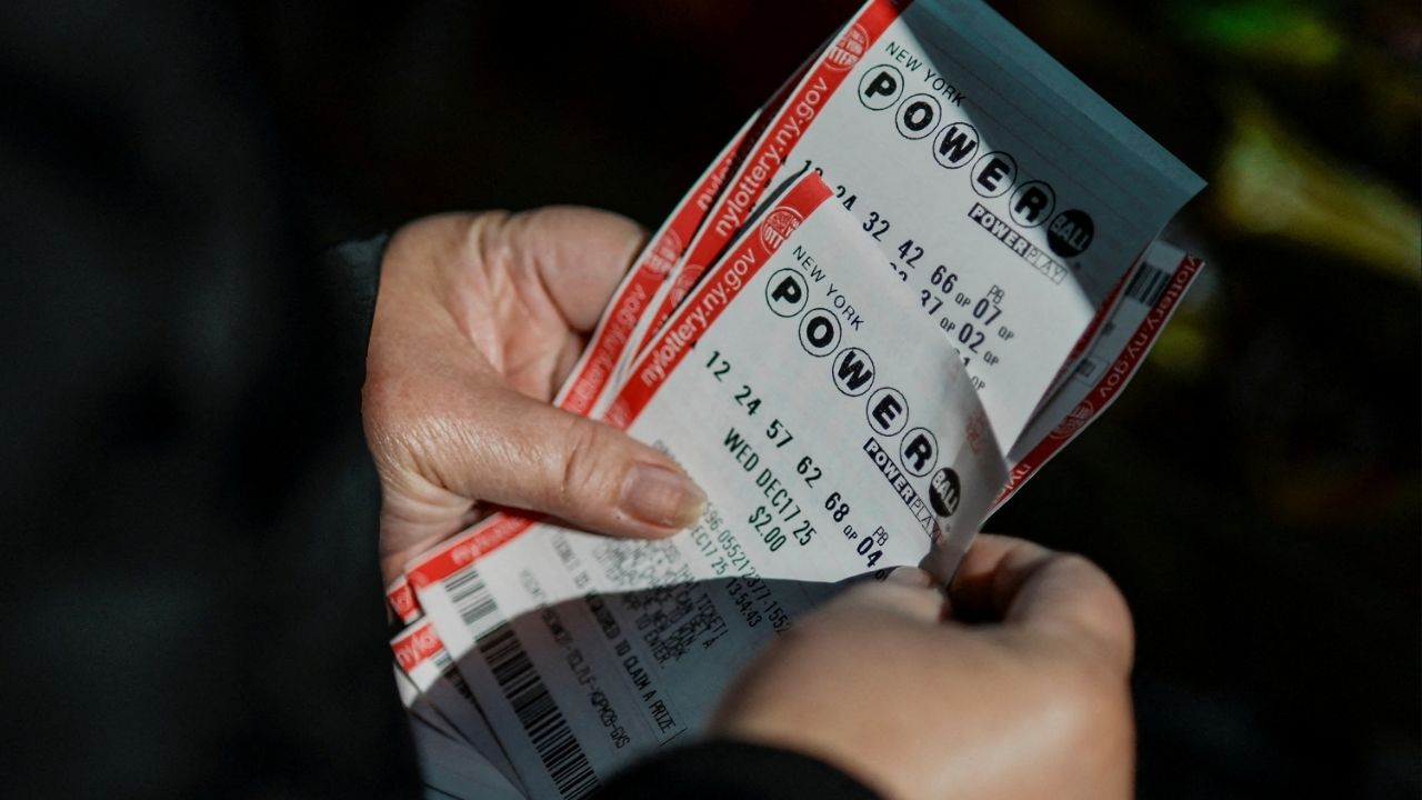 A person holds tickets for the $1.25 billion jackpot in the Powerball lottery drawing in New York City, U.S. December 17, 2025. (Reuters File)