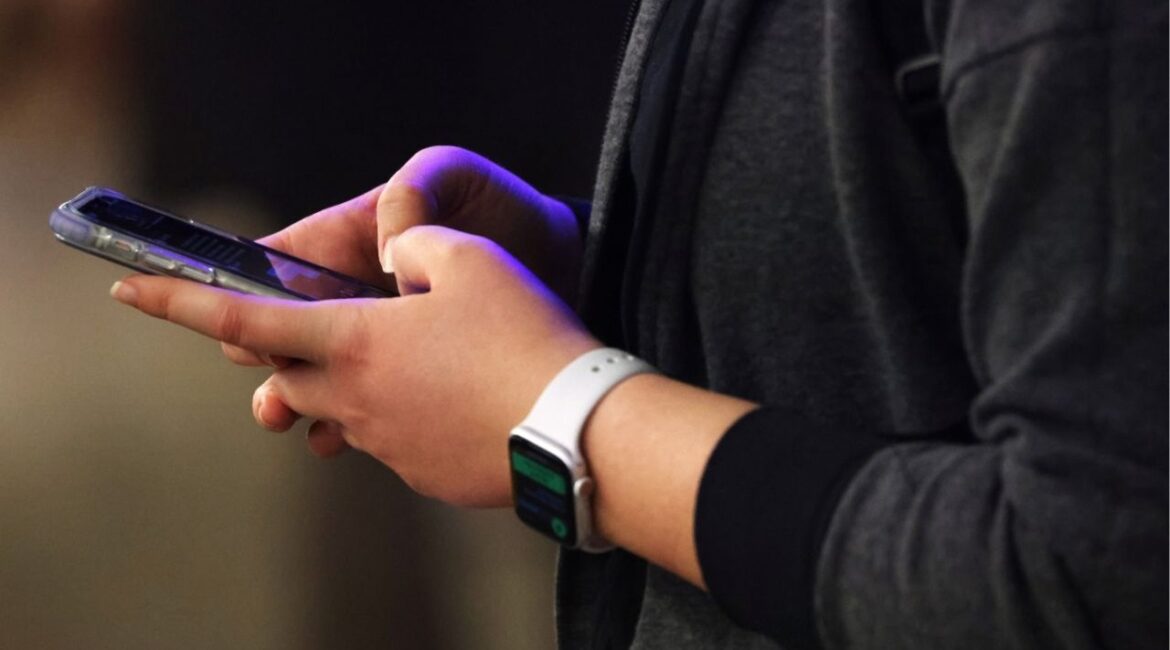 A person uses a smartphone in Manhattan, New York City, U.S., February 11, 2022. (Reuters/Andrew Kelly)