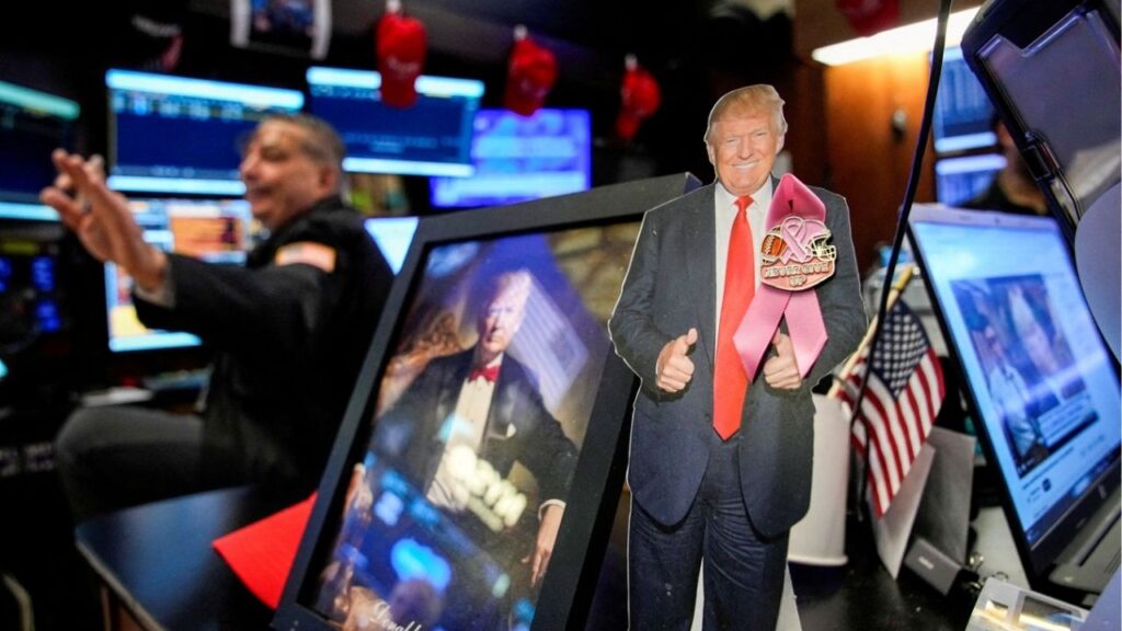 A picture of U.S. President Donald Trump as traders work on the floor at the New York Stock Exchange (NYSE) in New York City, U.S., December 2, 2025. (Reuters File)