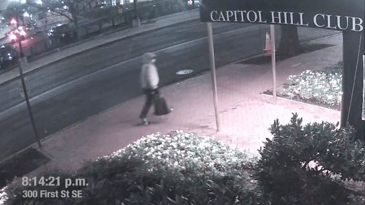 A suspect in the planting of explosive devices near the Democratic and Republican committee headquarters in Washington is seen walking past the Capitol Hill Club, also known as the National Republican Club of Capitol Hill, in Washington in this still frame taken from video released on March 9, 2021. (FBI/Handout via Reuters)
