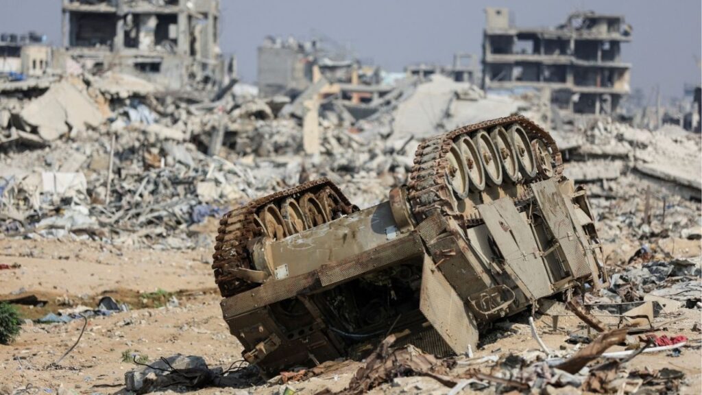 An armored personnel carrier next to destroyed buildings after Israeli military operations in Gaza City, November 7, 2025. (Reuters/Dawoud Abu Alkas)