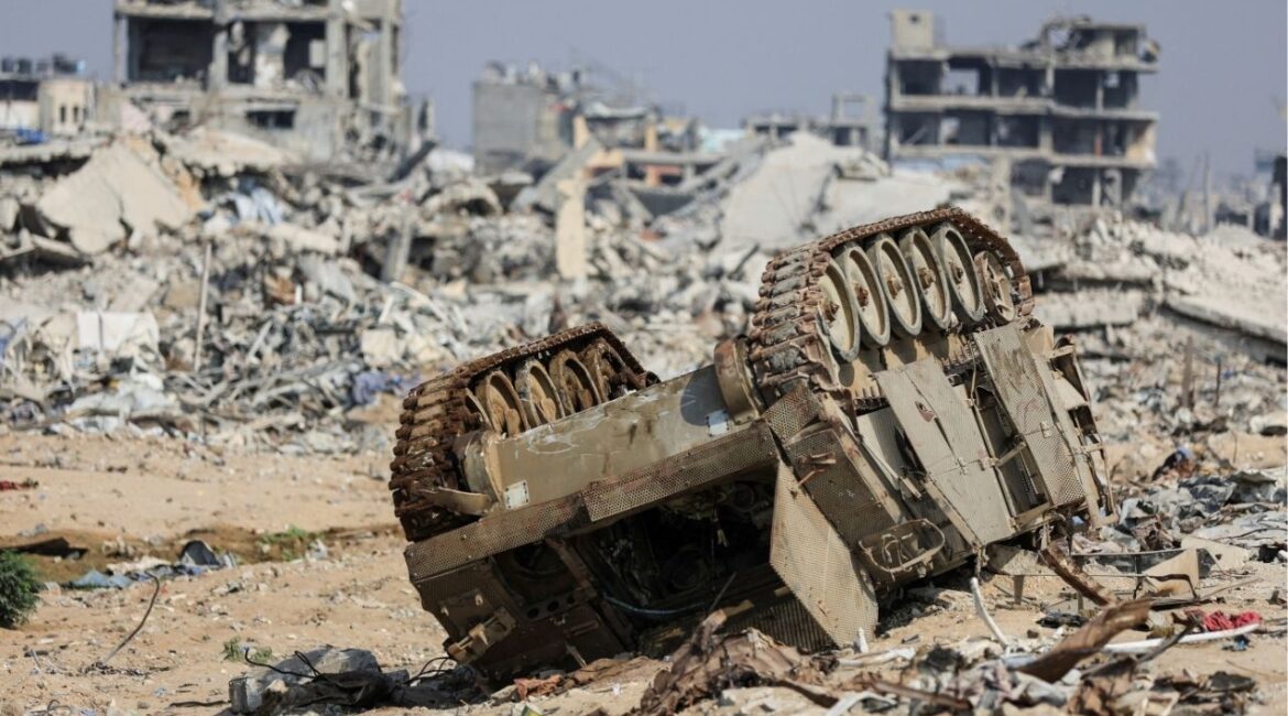 An armored personnel carrier next to destroyed buildings after Israeli military operations in Gaza City, November 7, 2025. (Reuters/Dawoud Abu Alkas)