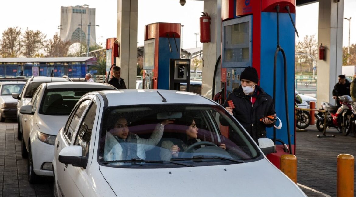 An attendant takes a customer’s credit card for payment at a gas station in the capital of Tehran, Iran, Dec. 13, 2025. Protesters took to the streets in the capital and other cities in Iran on Monday, Dec. 29, to decry surging inflation and the collapse of the national currency, which have thrown markets into chaos and punched holes in family budgets. (Arash Khamooshi/The New York Times)