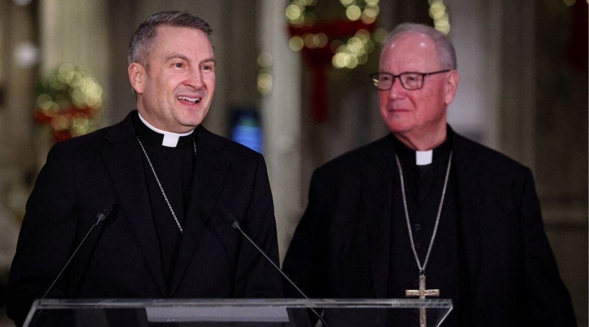 Archbishop-designate Ronald Hicks speaks flanked by Cardinal Timothy Dolan, outgoing Archbishop of New York, during a press conference at St. Patrick’s Cathedral, in New York City, U.S., December 18, 2025. (Reuters/Brendan McDermid)