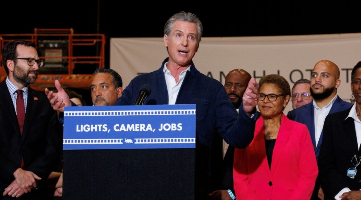 California Governor Gavin Newsom speaks next to Los Angeles Mayor Karen Bass as he announces a $750 million film and TV tax credit to help boost one of California's hallmark industries and the local economy from The Ranch, a Warner Bros. production facility, in Burbank, California, U.S., July 2, 2025. (Reuters/Mike Blake)