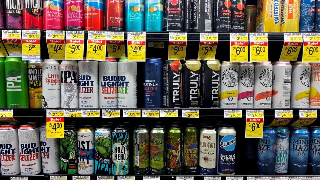 Cans of AB InBev's Bud Light hard seltzer are seen next to White Claw at Jewel-Osco supermarket in Chicago, Illinois, U.S. October 21, 2020. Picture taken October 21, 2020. (Reuters/Richa Naidu)
