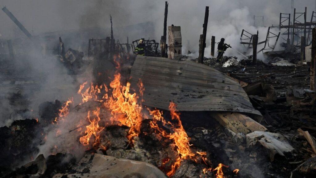 Emergency responders work at the site of a warehouse that was struck during a night of Russian missile and drone strikes, amid Russia's attack on Ukraine, in Novi Petrivtsi, outside Kyiv, Ukraine, December 6, 2025. (Reuters/Thomas Peter)