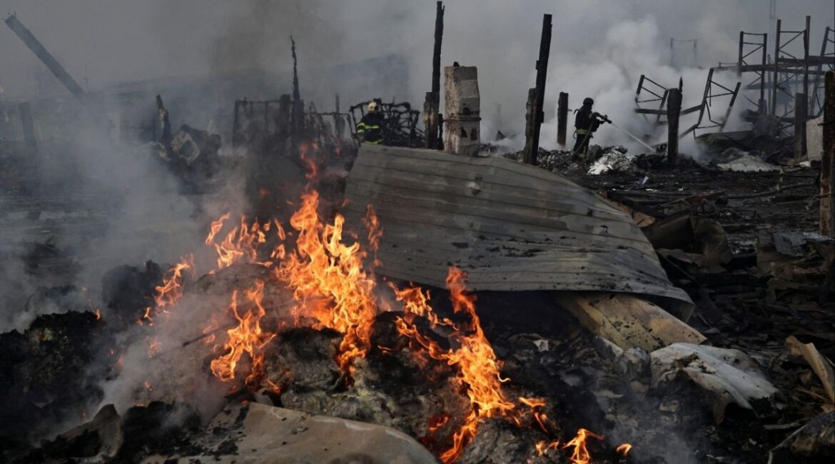 Emergency responders work at the site of a warehouse that was struck during a night of Russian missile and drone strikes, amid Russia's attack on Ukraine, in Novi Petrivtsi, outside Kyiv, Ukraine, December 6, 2025. (Reuters/Thomas Peter)