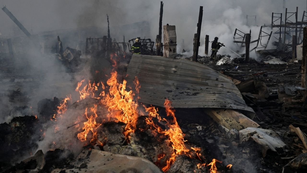 Emergency responders work at the site of a warehouse that was struck during a night of Russian missile and drone strikes, amid Russia's attack on Ukraine, in Novi Petrivtsi, outside Kyiv, Ukraine, December 6, 2025. (Reuters/Thomas Peter)