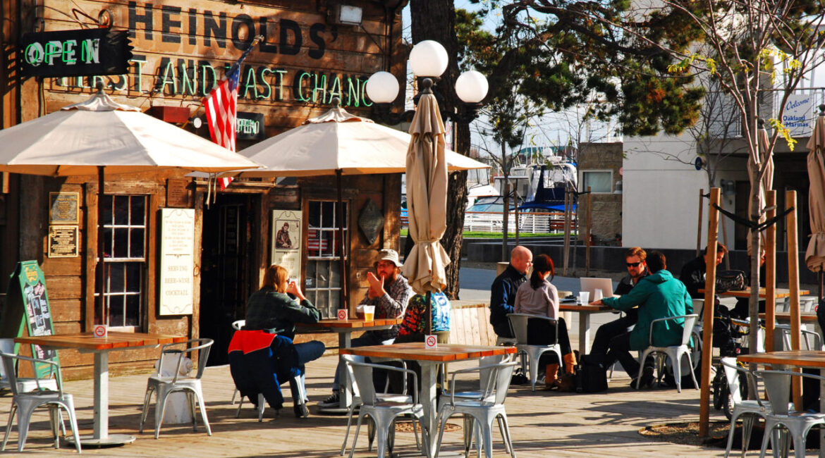 Image of people dining in front of the Heinold's First and Last Chance Saloon in Oakland, California
