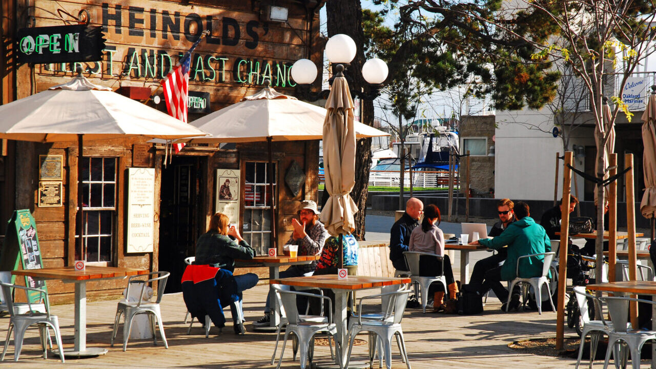 Image of people dining in front of the Heinold's First and Last Chance Saloon in Oakland, California