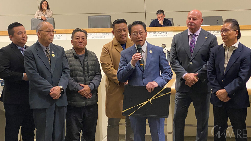 Fresno City Councilmember Brandon Vang honors Hmong Inc., organizer of the annual Hmong New Year celebration