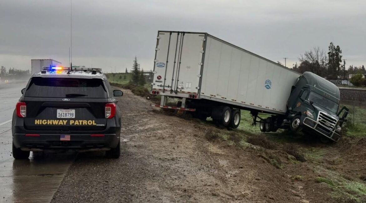 Heavy rain in Delhi caused a big rig to lose control and crash, prompting the CHP to warn drivers to slow down and allow extra space in wet conditions. (CHP)