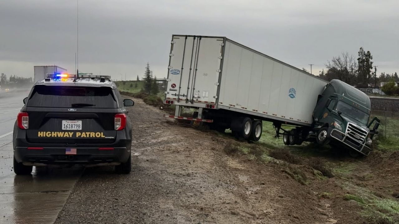 Heavy rain in Delhi caused a big rig to lose control and crash, prompting the CHP to warn drivers to slow down and allow extra space in wet conditions. (CHP)