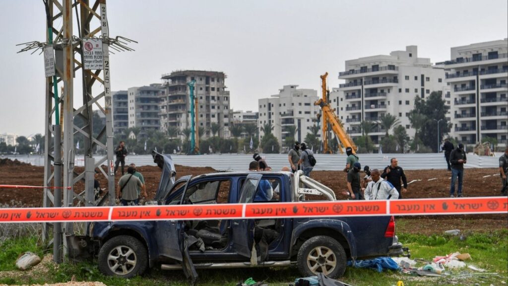 Israeli security forces inspect the scene where a vehicle was used by assailant in a suspected ramming and stabbing attack that killed two people in northern Israel according to Israeli authorities, in Afula, Israel December 26, 2025. (Reuters/Gil Eliyahu)