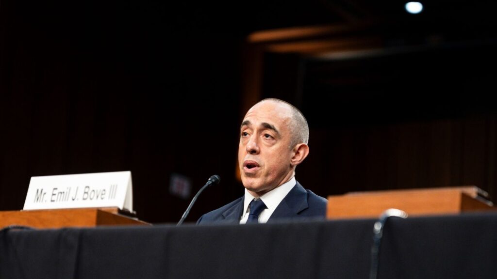 Image of Emil Bove II wearing a dark suit and white shirt testifying in the Senate at his judicial nomination hearing.