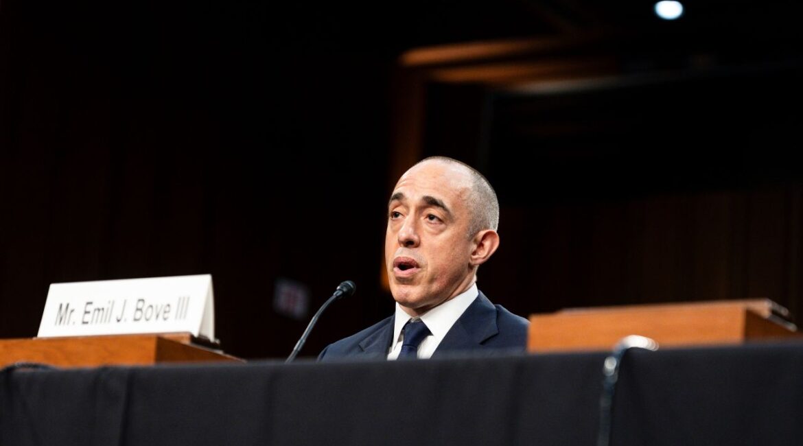 Image of Emil Bove II wearing a dark suit and white shirt testifying in the Senate at his judicial nomination hearing.