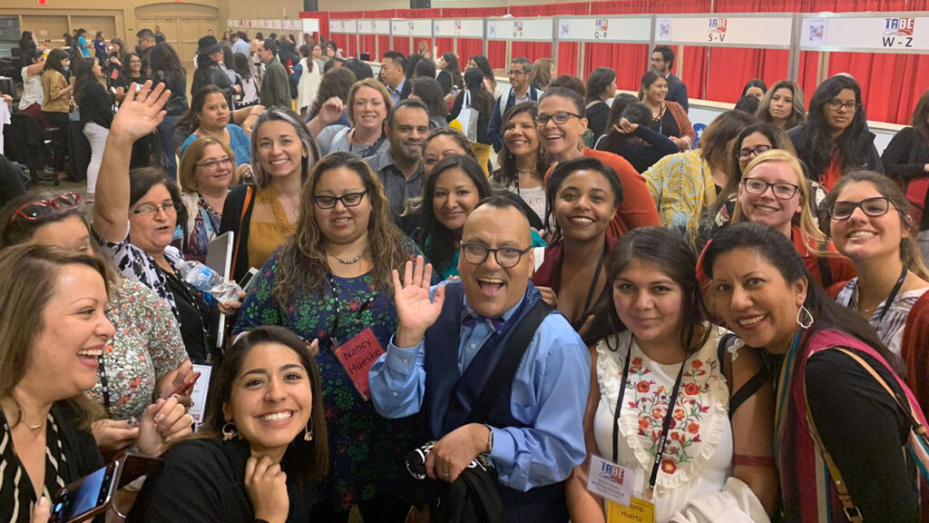 José Medina poses with educators at the Texas Association for Bilingual Education conference