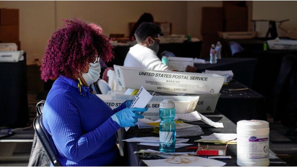 Mail-in ballots are processed in Atlanta on Nov. 2, 2020. The election interference case against President Donald Trump in Georgia was dismissed in late November 2025, but the ghosts of the 2020 election are still looming over the state as next year’s midterms approach. (Nicole Craine/The New York Times)
