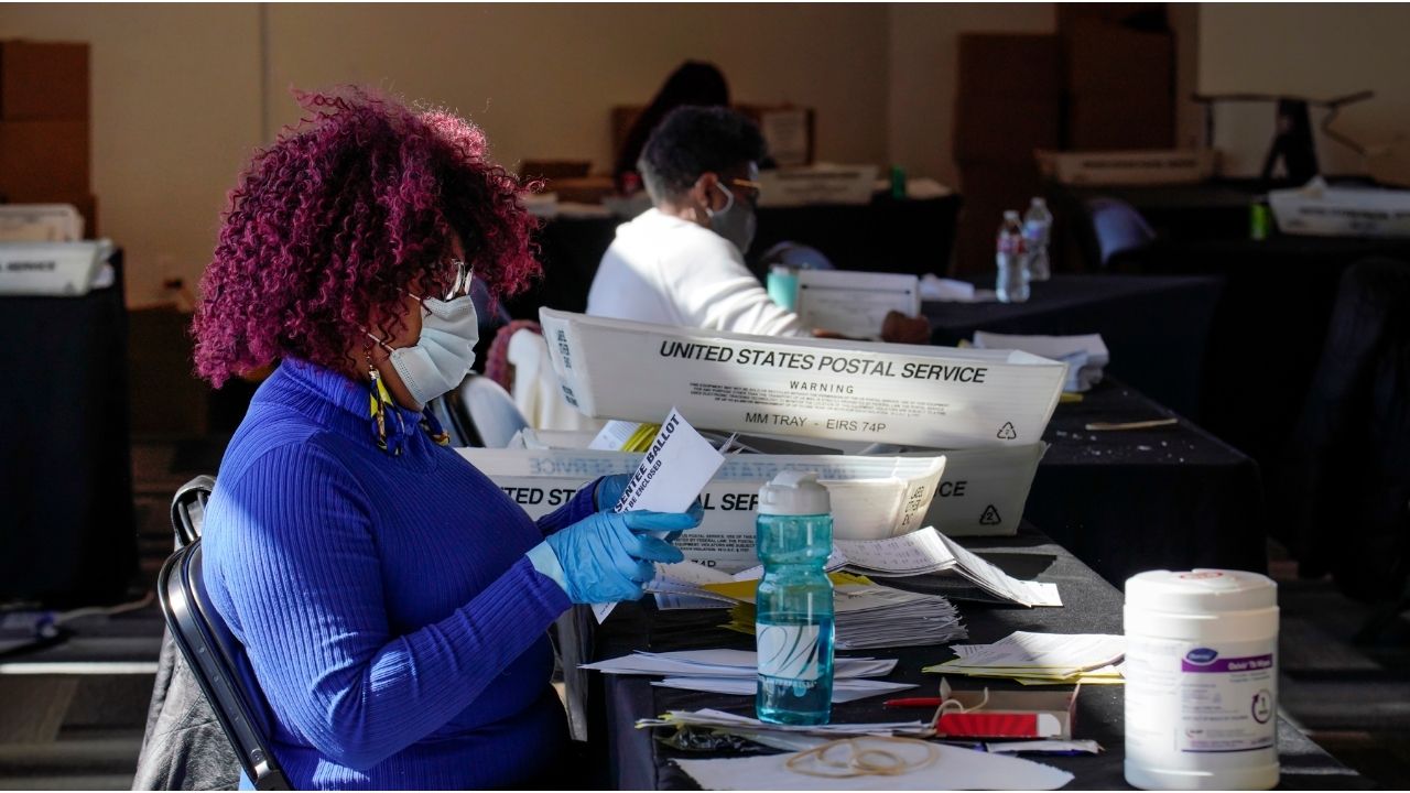 Mail-in ballots are processed in Atlanta on Nov. 2, 2020. The election interference case against President Donald Trump in Georgia was dismissed in late November 2025, but the ghosts of the 2020 election are still looming over the state as next year’s midterms approach. (Nicole Craine/The New York Times)