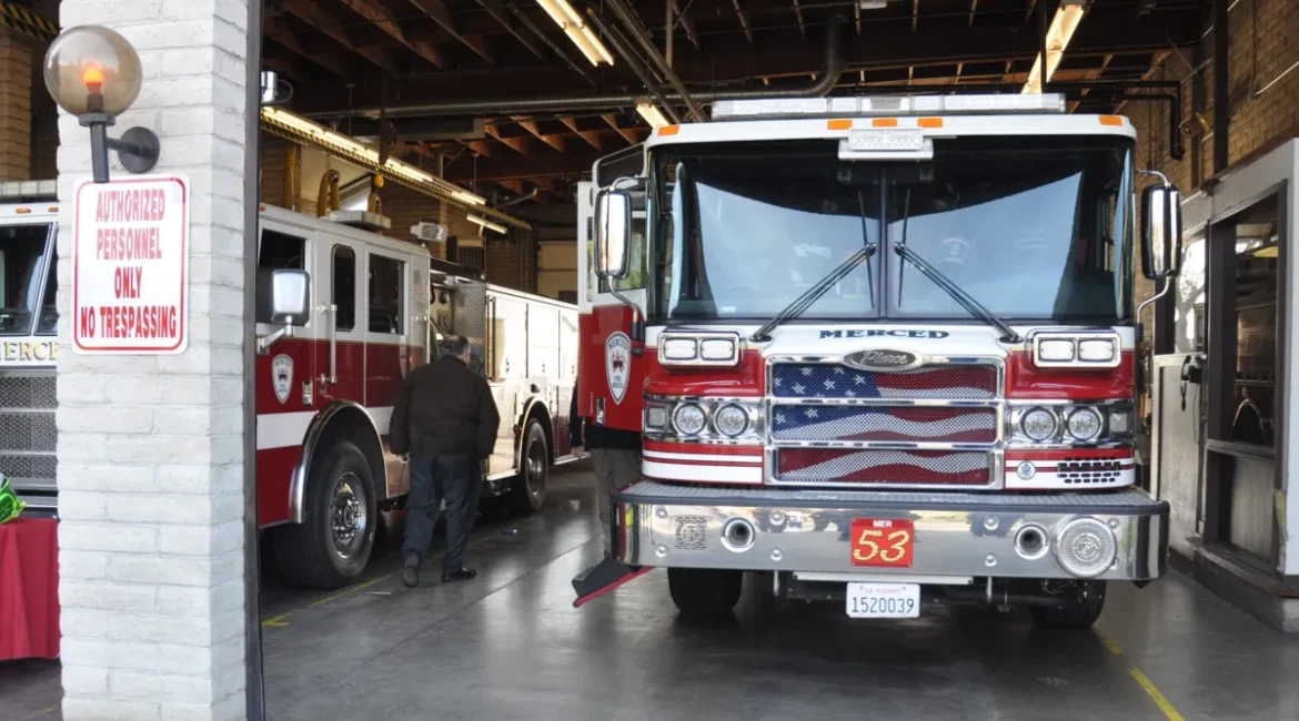 Image of sparkling clean firetruck inside a fire station