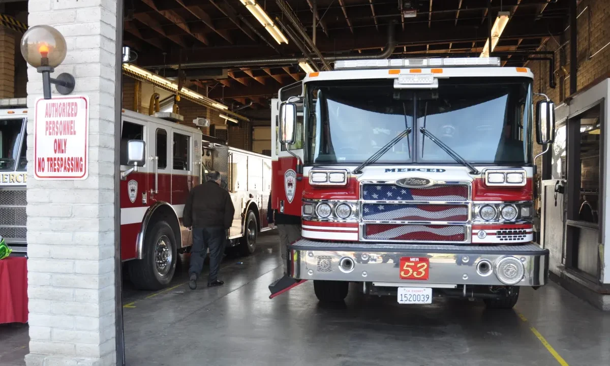 Image of sparkling clean firetruck inside a fire station