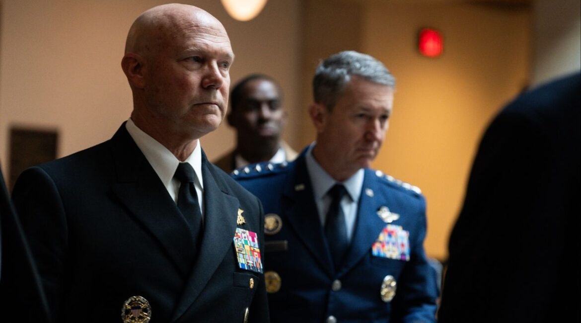 Navy Admiral Frank “Mitch” Bradley, left, accompanied by Chairman of the Joint Chiefs of Staff Air Force Gen. Dan Caine, right, arrives for a closed door classified meeting with lawmakers on Capitol Hill in Washington, Dec. 4, 2025. Top military officers will play for senior members of Congress a video of the Sept. 2 attack on a boat suspected of carrying drugs, including the follow-up strikes that have been at the center of a growing debate over the campaign. (Tierney L. Cross/The New York Times)